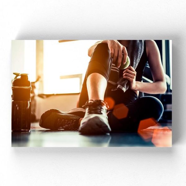 Resting Fitness Woman Wrapped Canvas -Image by Shutterstock